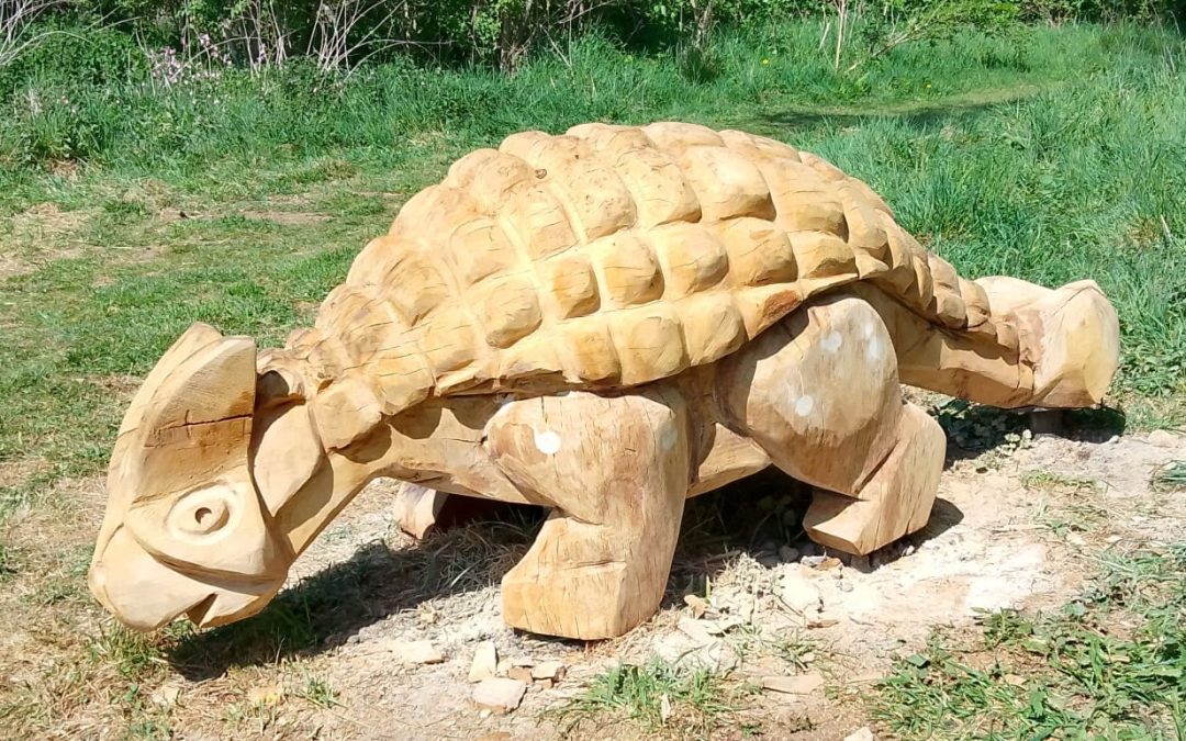 What Makes A Hand-Carved Totem Pole Different From Mass-Produced Garden Sculptures?